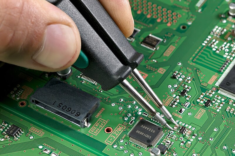 Removal of surface-mount device using soldering tweezers