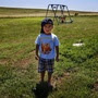 Derrin Yellow Robe, 3, stands in his great-grandparents' backyard on the Crow Creek Reservation in South Dakota. Along with his twin sister and two older sisters, he was taken off the reservation by South Dakota's Department of Social Services in July 2009 and spent a year and a half in foster care before being returned to his family.