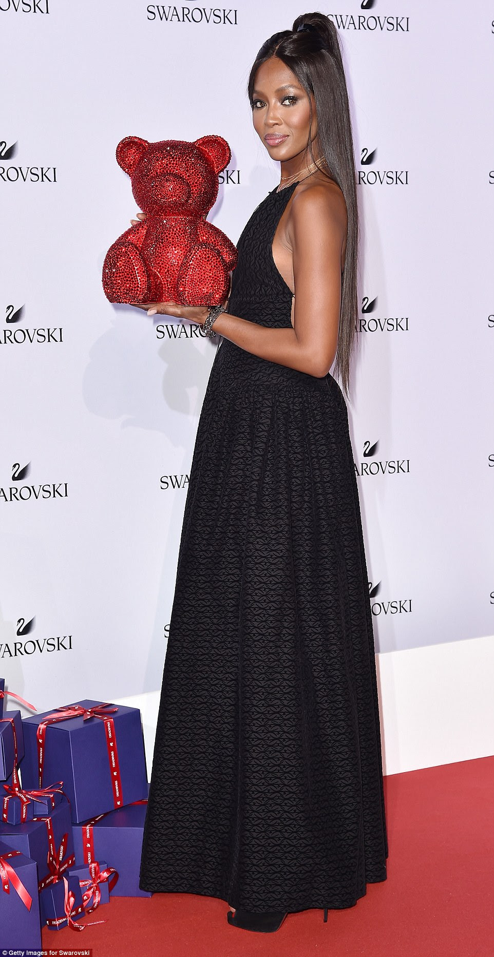Chic: Letting the statement dress speak for itself, Naomi - one of the original supermodels of the Nineties, dressed her decolletage with a smattering of delicate gold necklaces
