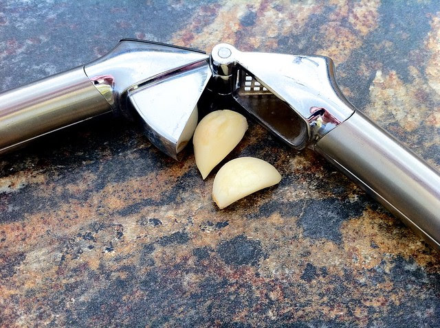 2 Garlic Cloves with Garlic Press