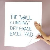 Wall clinging dry erase pad