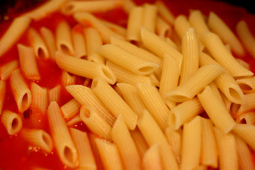 Penne with tomato sauce cooking