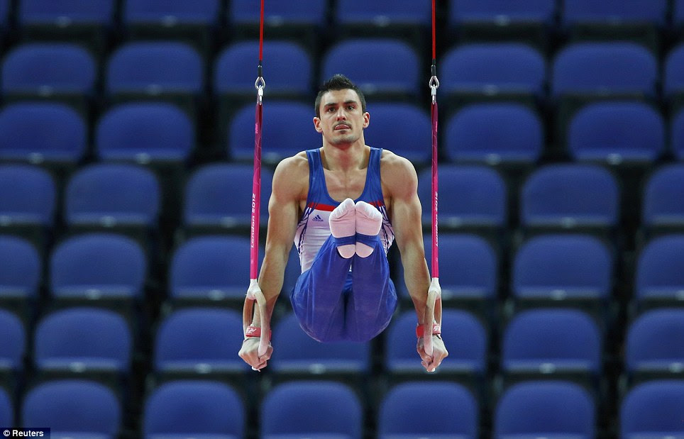 Deserted: Gymnast Pierre Yves Beny of France competes in front of empty seats in the North Greenwich Arena