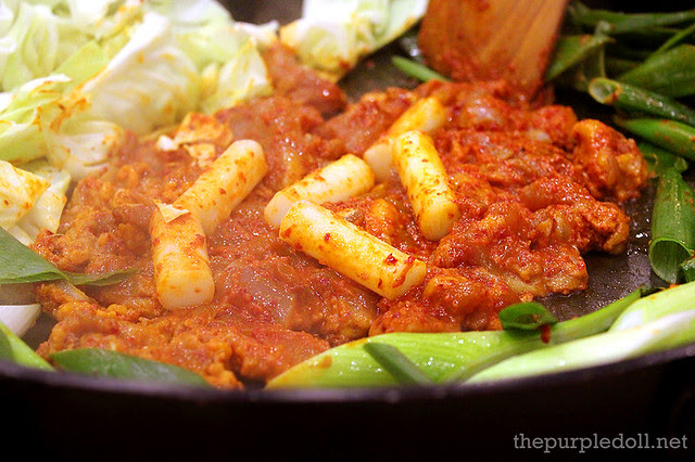 Cooking Marinated Chicken Galbi and Sliced Pork Belly