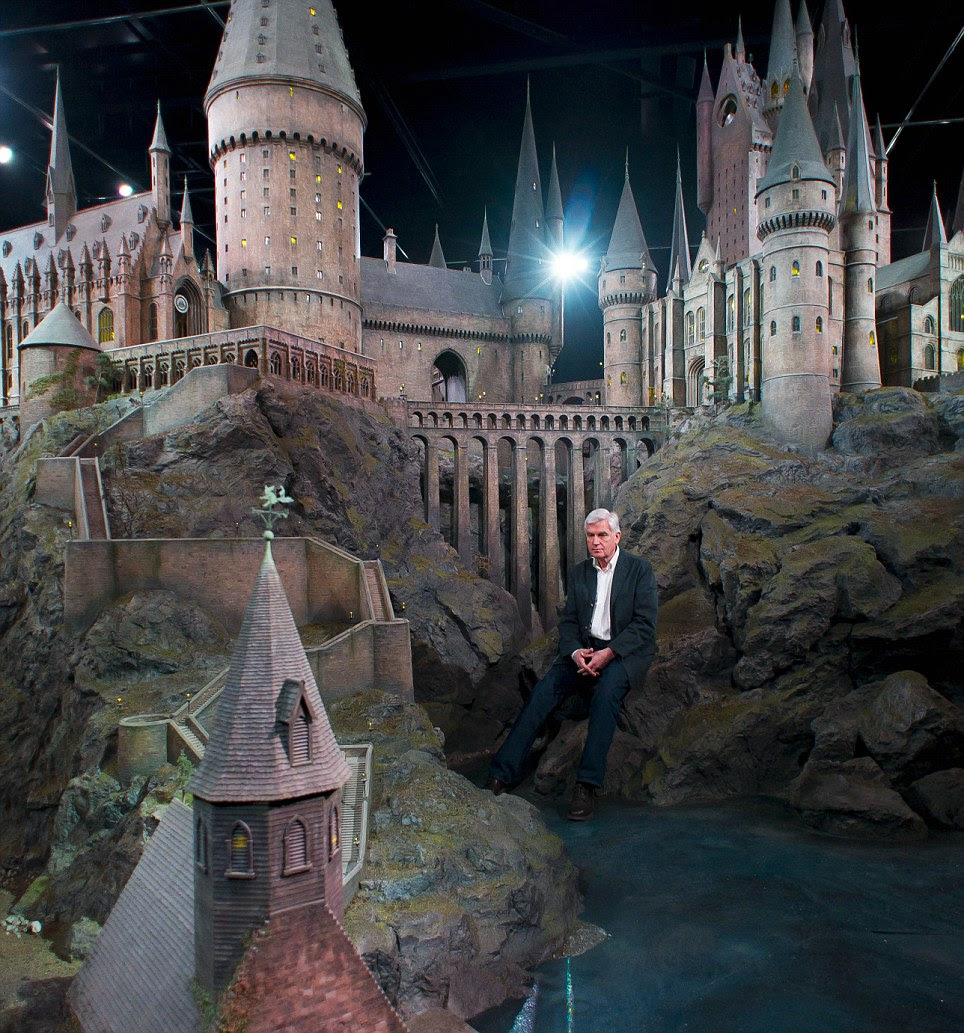 Enormous: The castle was based on Durham Cathedral and Alnwick Castle. Stuart Craig, production manager, is dwarfed by the massive structure