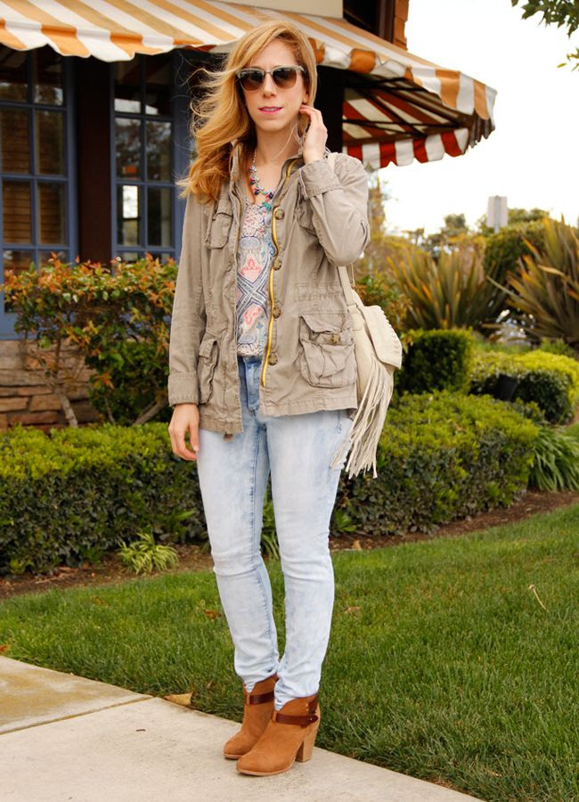LA fashion blogger The Key To Chic wears a jeweled J Crew necklace, Old Navy field jacket, Mossimo print top, Mossimo light wash skinny jeans, and Rag & Bone Harrow boots
