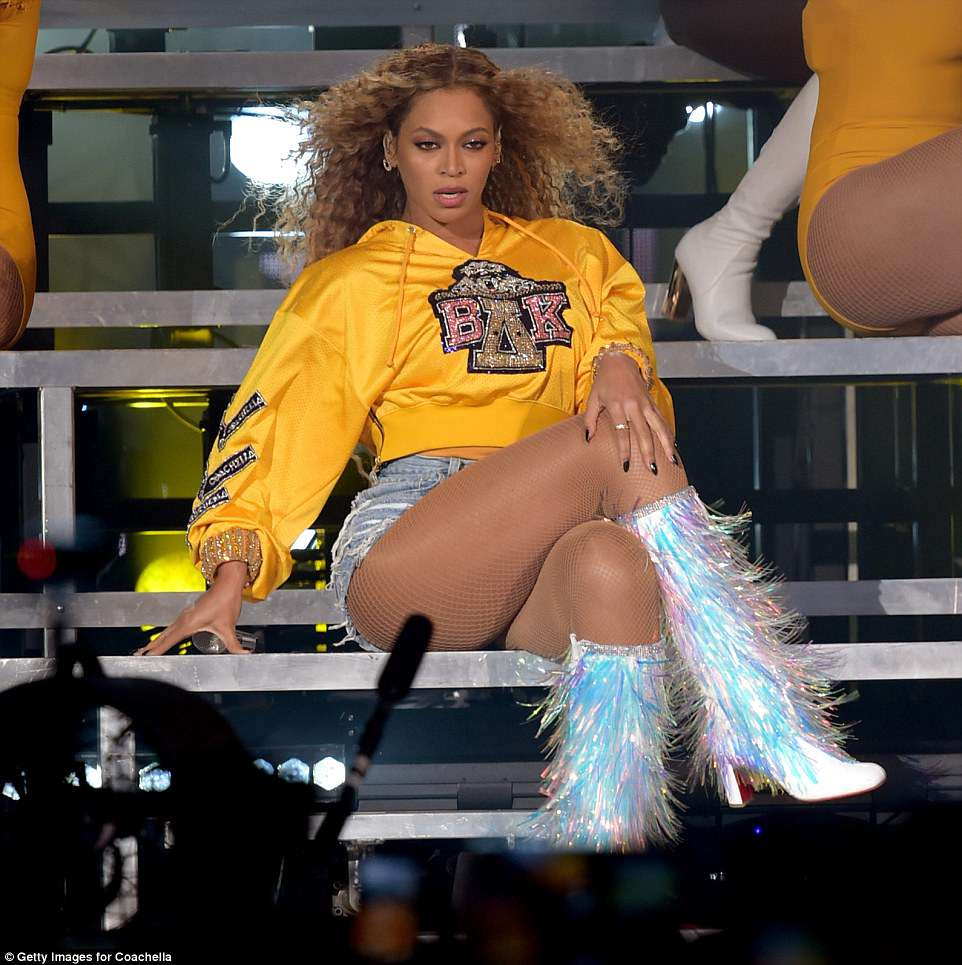 Work it: The superstar was every inch the diva as she struck a sultry pose on the steps and flashed her incredible legsÂ