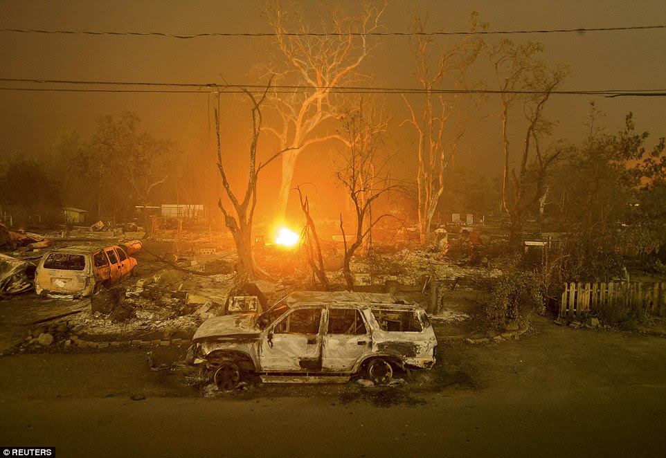 Devastation: Burned out remains of trucks, homes and trees scorched by the fire that roared unchecked through Middletown 