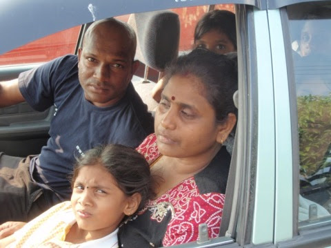 family Mohan, who is driving, is the younger brother of the deceased. On his left is the grieving mother of the late Kugan