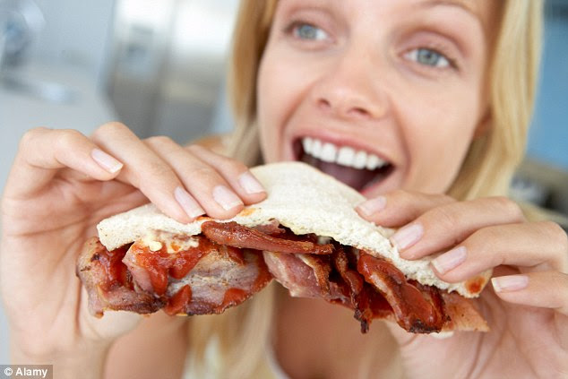 Processed meat like the bacon in this sandwich (pictured) contains high levels of salt and trans fats 