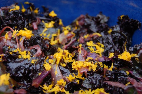 Wilted kale salad with balsamic vinegar, caramelized onions and orange zest