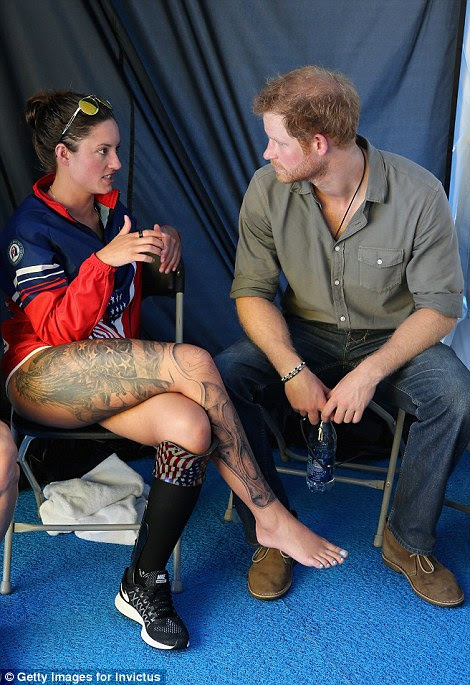 Prince Harry took some time to chat to US swimming team member who showed off her impressive leg tattoos