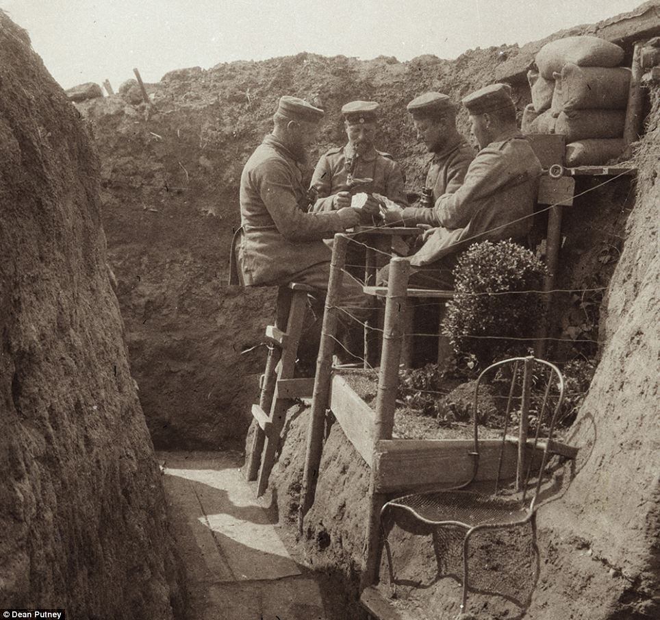 Pictures such as this one of German soldiers playing cards together next to their trenches 'garden'