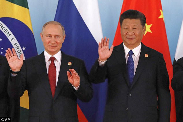Meeting: Chinese President Xi Jinping, right, and Russian President Vladimir Putin, left, are both likely to reject US-proposed sanctions on North Korea