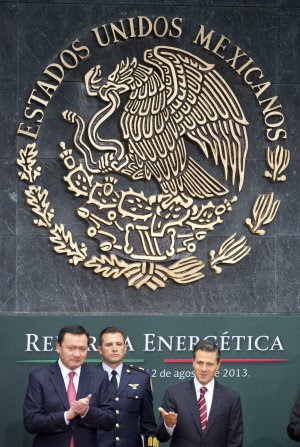Mexico's President Enrique Pena Nieto, right, greets …