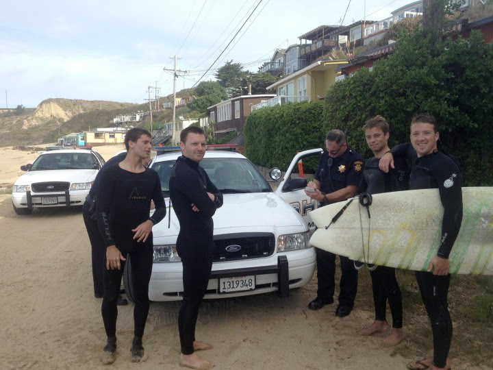 Image: Surfers are arrested during a dispute over beach access