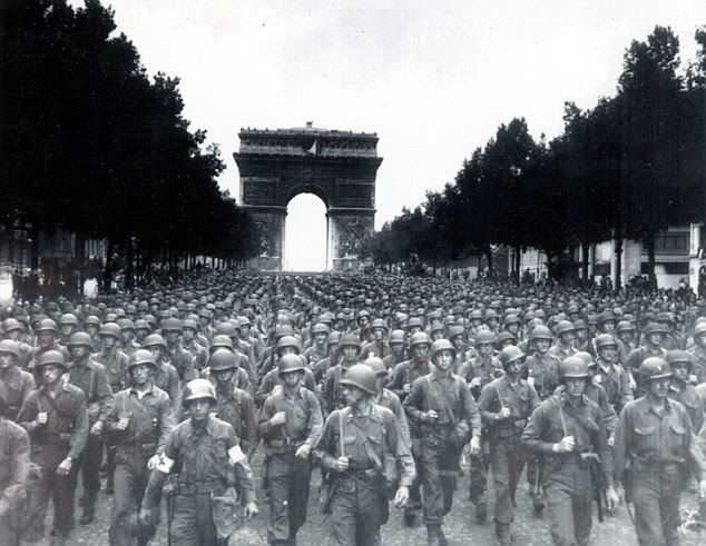 Storming the city: American soldiers marched along Champs d'Elysees after overthrowing the Nazis