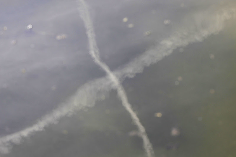 contrails on water
