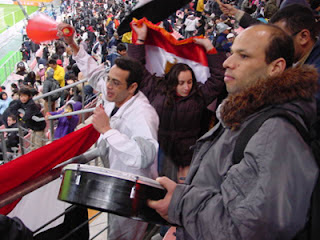 al Ahly supporters celebrate their team's win in the opening game of the 2007 FIFA Club World Championship