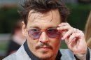 Cast member Depp arrives on red carpet to promote film "The Lone Ranger" in Berlin