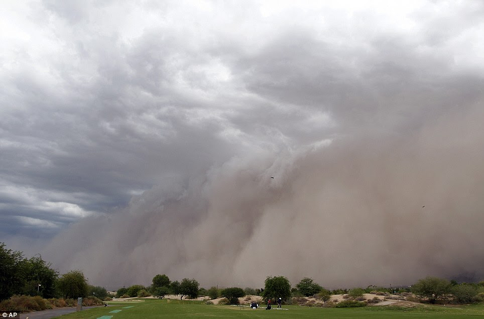 Second coming: A large dust cloud was seen making its way through the Phoenix suburb of Laveen on Sunday 