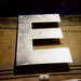 E E