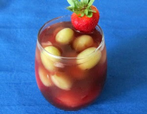 frozen fruit in cherry beverage