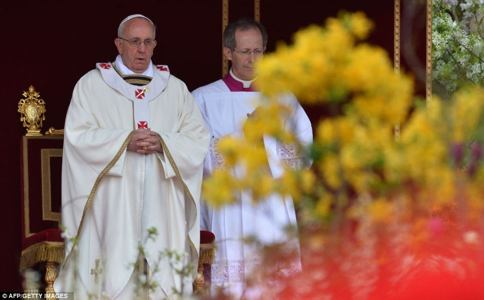 Expectant: The faithful had already filled the square hours before the Mass began in mid-morning, presided over by Pope Francis