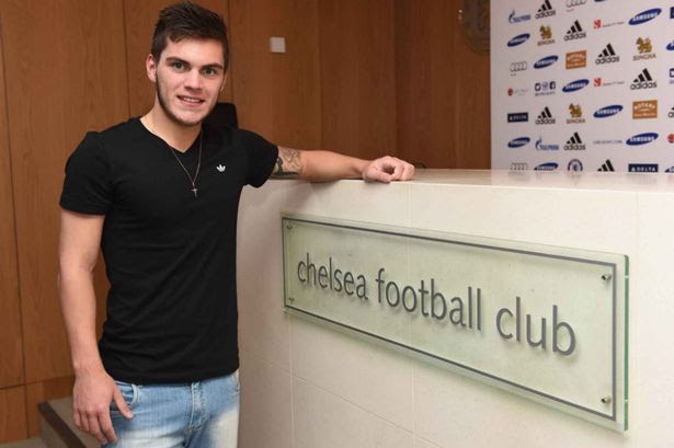 Say cheese: Nathan during his tour of Chelsea's training facilities Nathan signs a pre contract for Chelsea at the Cobham Training Ground