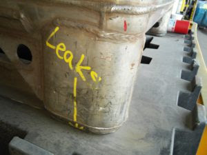 This photo shows an example of a Leaking Waste Solvent Hazardous Waste Tank identified during a hazardous waste inspection