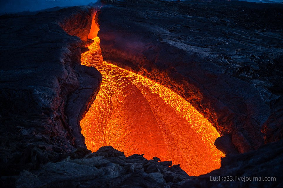 Sorry to int-erupt: The lava has split the mountain in two, digging its way through the rock as it gradually melts