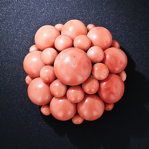 http://www.pinterest.com/pin/334603447284982469/ Large Antique Coral Cluster Brooch Measuring just a smidgen shy of one-and-three-quarters inches across, this beautiful nineteenth-century coral cluster brooch is significantly larger than the usual.The center button alone measures 15 millimeters across and is orbited by three rows of matching dark salmon color cabochons.