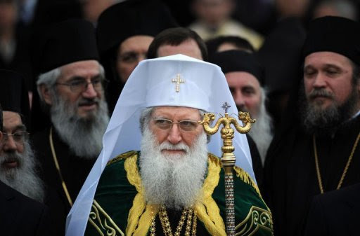 Newly elected, Bulgarian Orthodox Church Patriarch Neophyte stands among church bishops at the golden-domed