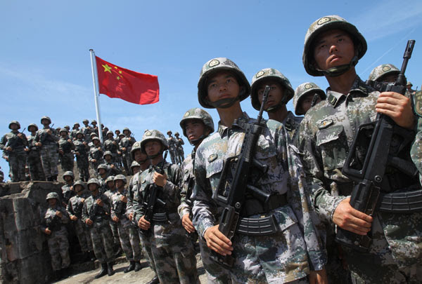 Soldiers of People's liberation Army pose for photograghs at teh Stanley barracks in Hong Kong earlier this month. PLA gaining trust in HK