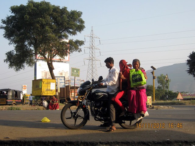Three on Motorcycle at Kanhe