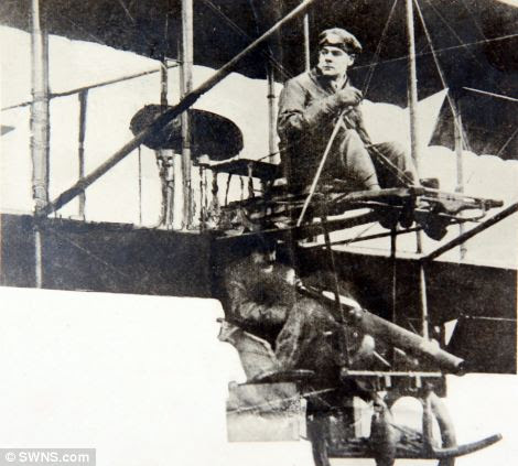 Loraine, above, flying a plane with a gunner around the time of First World War