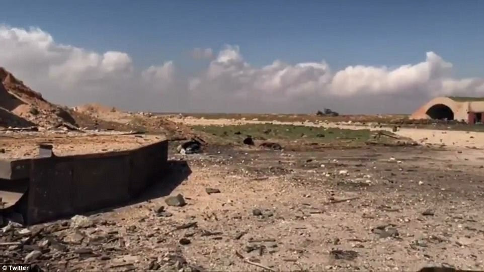 Pictures show rubble strewn across the airfield at the Syrian military base this morning. The Syrian Army called it an 'act of 'aggression'