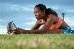 Photo: Woman stretching before jog