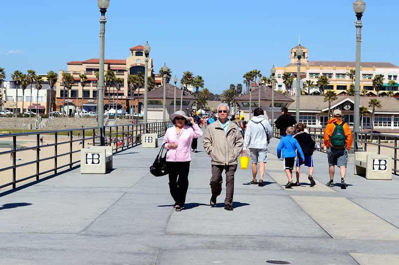 Parents walking along the pier