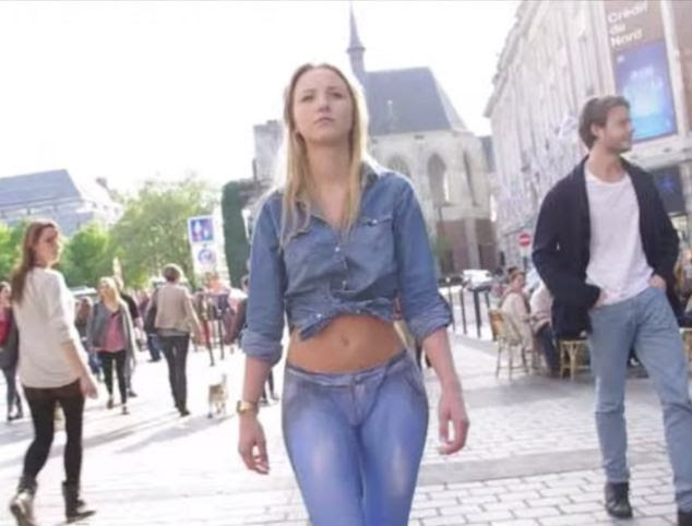 That's one way to get attention! A French model walks down the streets of Lille with jeans painted on