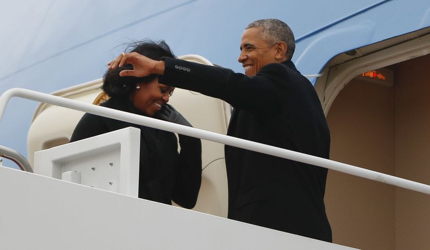 President Barack Obama and first lady Michelle Obama board Air Force One at Andrews Air Force Base, Md., Tuesday, Jan. 10, 2017. Obama is traveling to Chicago to deliver a farewell address, continuing a tradition established by the nation's first president more than two centuries ago. (AP Photo/Pablo Martinez Monsivais)