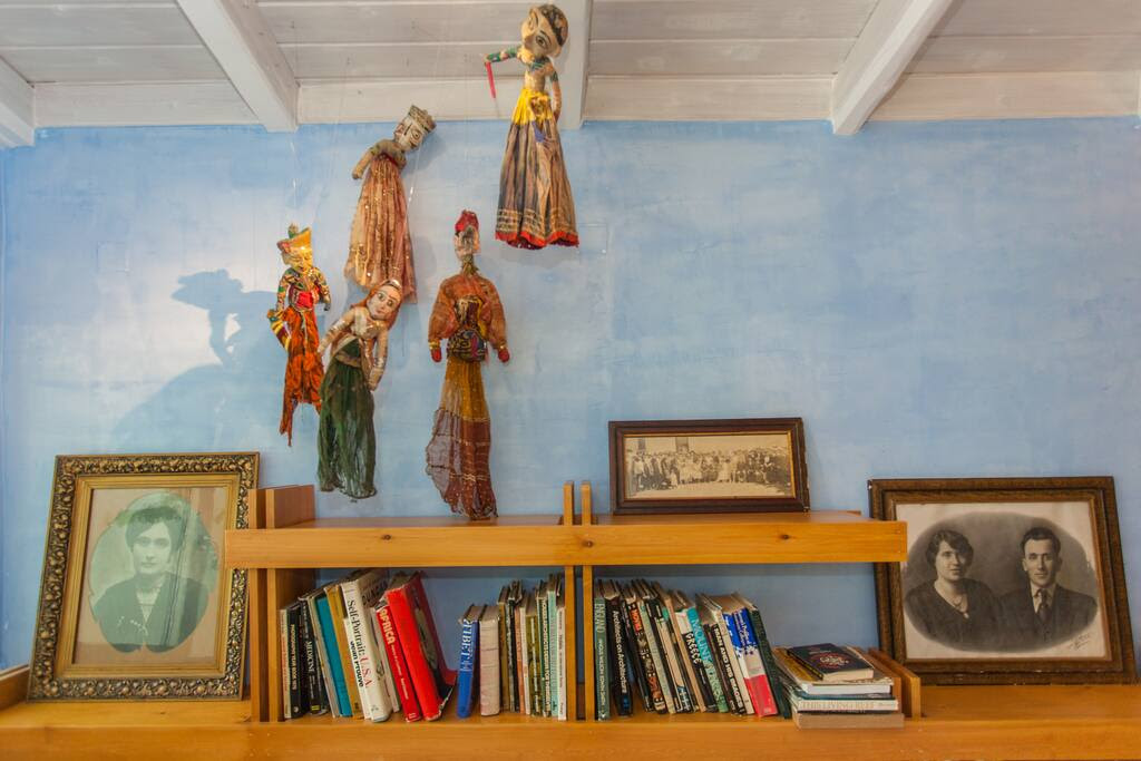 Indian theatre muppets, old family photos and books about architecture.