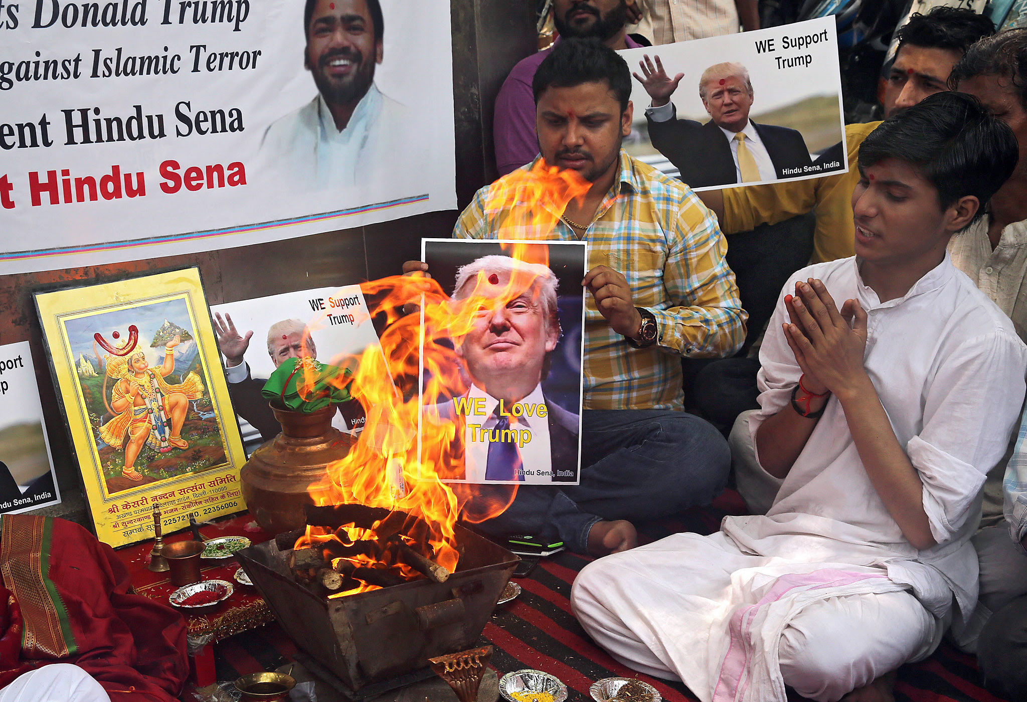 Right-wing organisation Hindu Sena perform Hindu fire rituals in support of Donald Trump in New Delhi...epa05298860 Indian activists from the right-wing organisation Hindu Sena perform Hindu fire rituals in support of US Republicans presidential candidate Donald Trump in New Delhi, India, 11 May 2016. Right-wing organisation Hindu Sena activists prayed to the Hindu gods and performed rituals to ensure the victory of Donald Trump in US Presidential elections and urged the Indian origin people living in USA to vote and support him. EPA/RAJAT GUPTA