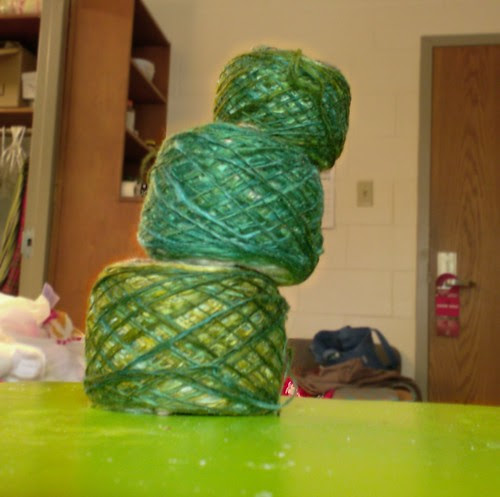 Handspun bombyx silk singles yarn in green, blue, and brown