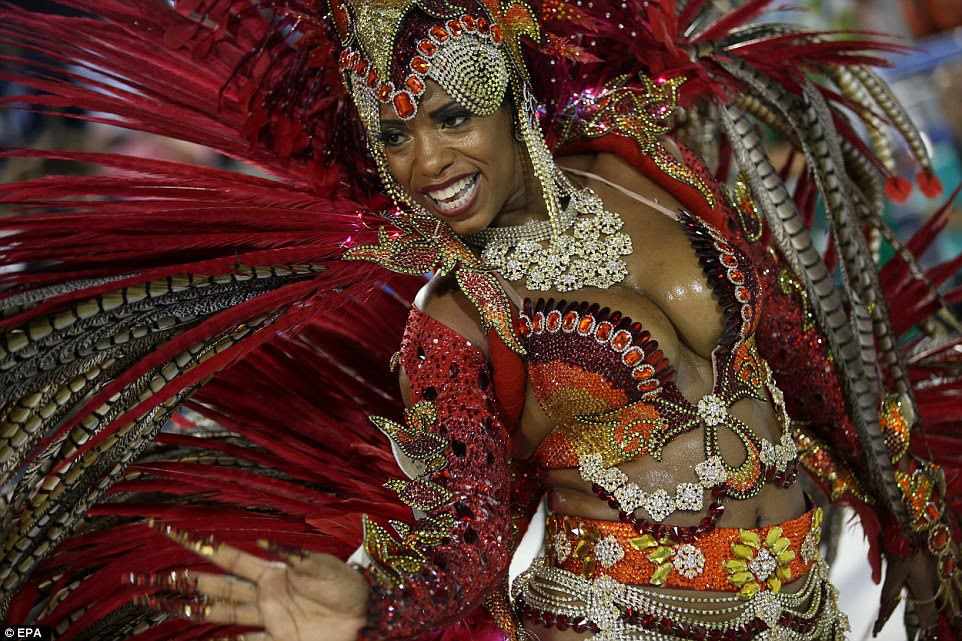 Dancers from different samba schools wore a sparkling array of revealing outfits as they competed against one another in the carnival celebration at the Marques de Sapucai Sambodrome
