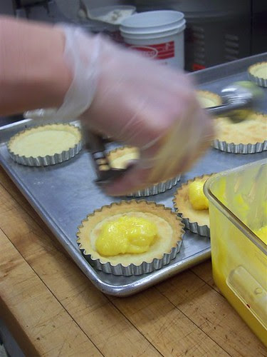 Adding lemon curd to shells