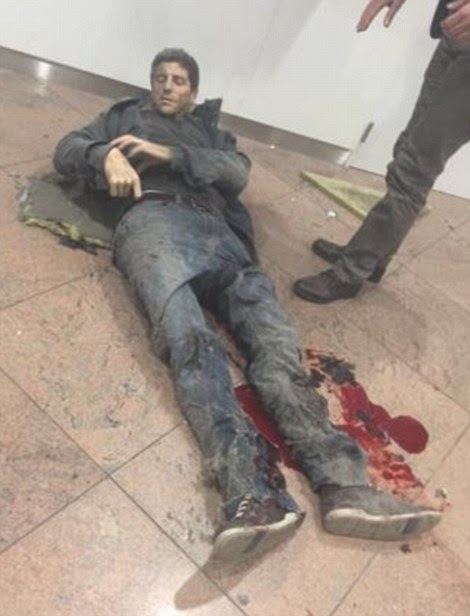 A man lies injured in the terminal