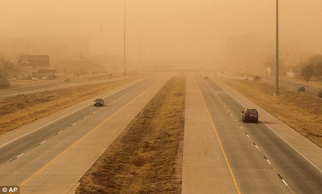 Seeing through the storm: A dust storm in West Texas triggered a series of accidents Wednesday that killed one person and injured at least 17 others