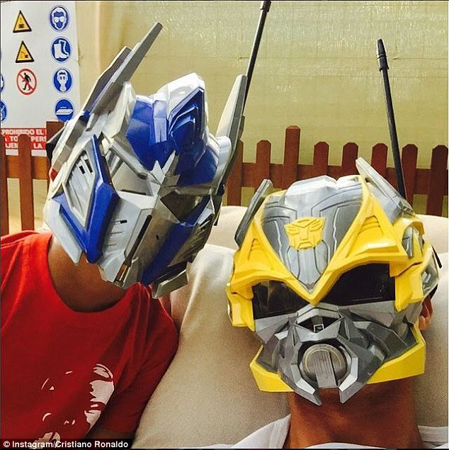 Playtime: The Real Madrid player and his son Cristiano Jnr wore Transformers masks in a photo he uploaded to his Instagram page earlier in the week