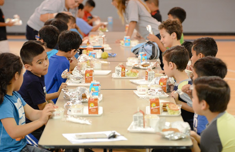 Children enjoy lunches provided by the Brownsville Independent School District on Wednesday, June 8, 2016, at the Olivera Park gymnasium in Brownsville, Texas. The local school district provides free lunches to any child under 18 who needs a meal, regardless of their status as a student with the school district. (Jason Hoekema/The Brownsville Herald via AP) MANDATORY CREDIT